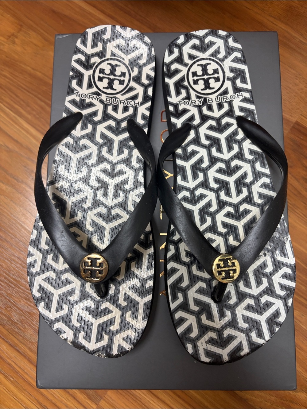 Tory Burch Black and White Logo Pattern Flip Flops with Gold Medallions